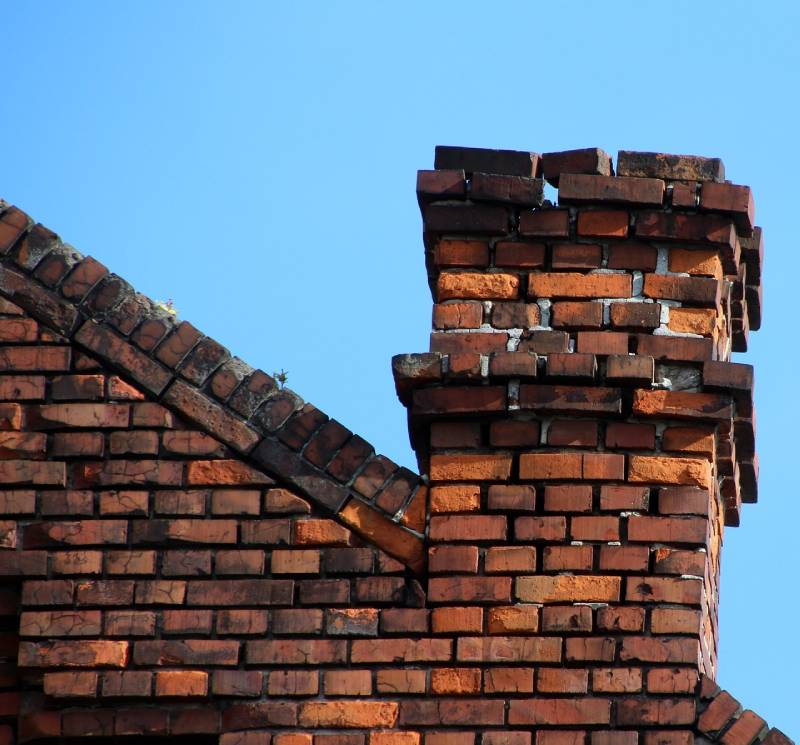 Signs Your Pasadena Home Needs a Chimney Inspection Damaged chimney on an Pasadena home showing cracks and missing mortar